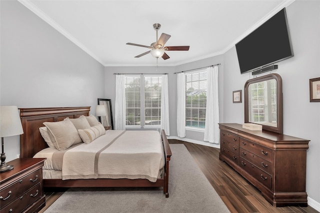 bedroom featuring dark wood-type flooring, crown molding, ceiling fan, and baseboards