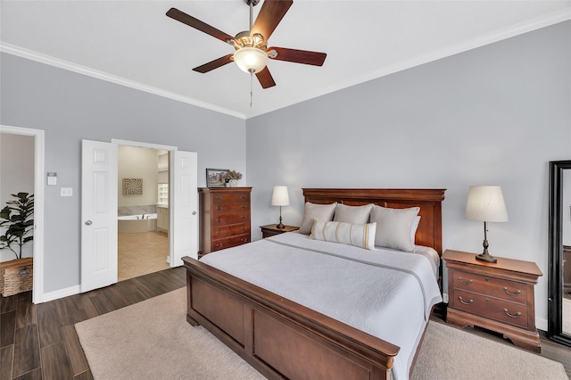 bedroom with baseboards, dark wood finished floors, ornamental molding, ensuite bathroom, and ceiling fan
