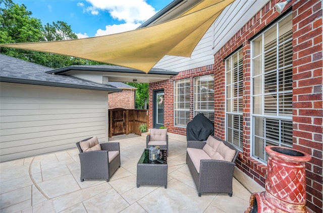view of patio / terrace with an outdoor living space and fence