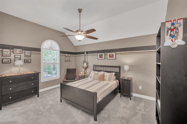 carpeted bedroom with baseboards, vaulted ceiling, and ceiling fan