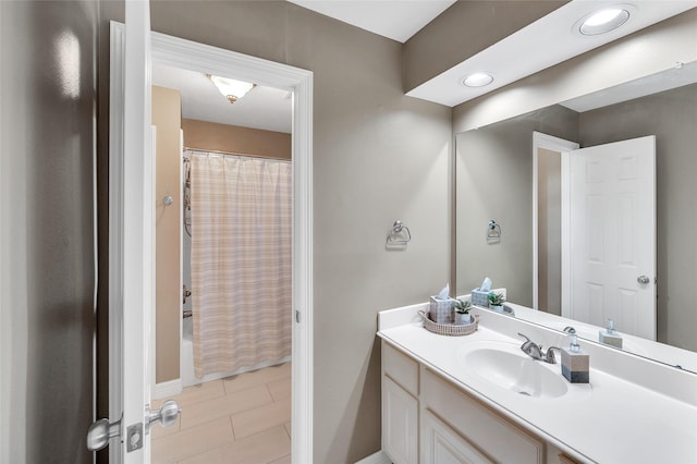 bathroom with vanity, tile patterned flooring, and shower / bath combination with curtain