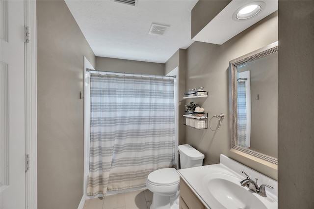 full bathroom featuring toilet, tile patterned floors, vanity, and curtained shower