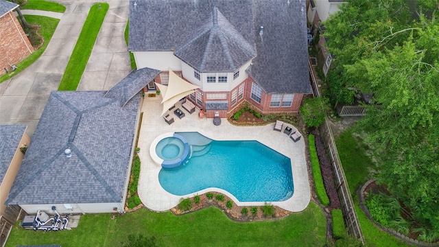 view from above of property featuring a pool area