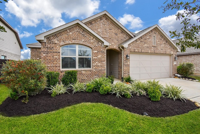 single story home with brick siding, driveway, and a garage