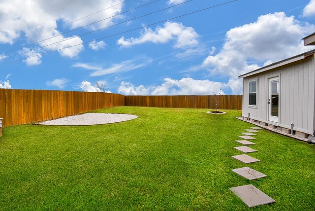 view of yard with a fenced backyard