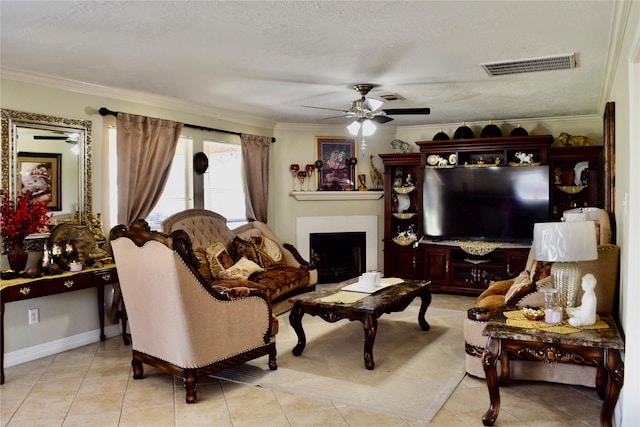 2519 Foxville Dr, Houston, TX 77067 - living room with ceiling fan, visible vents, light tile patterned flooring, crown molding, and a fireplace