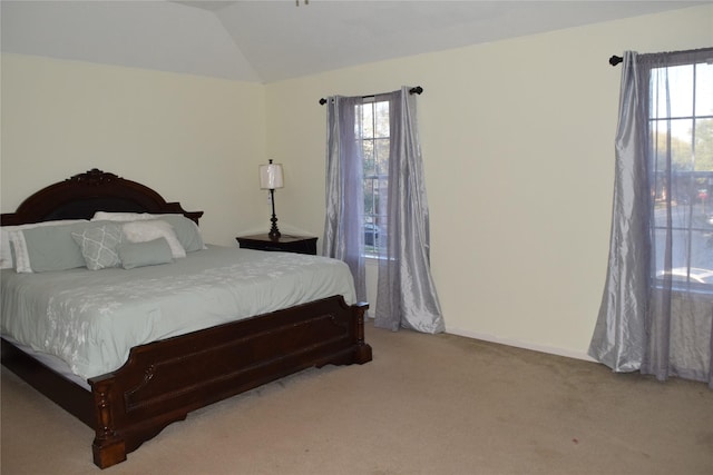 2519 Foxville Dr, Houston, TX 77067 - bedroom with lofted ceiling, multiple windows, baseboards, and light colored carpet
