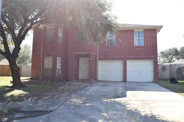 2519 Foxville Dr, Houston, TX 77067 - view of front facade with concrete driveway, an attached garage, fence, and brick siding