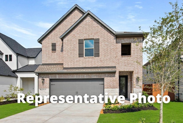 view of front of property with brick siding, an attached garage, concrete driveway, a front yard, and roof with shingles