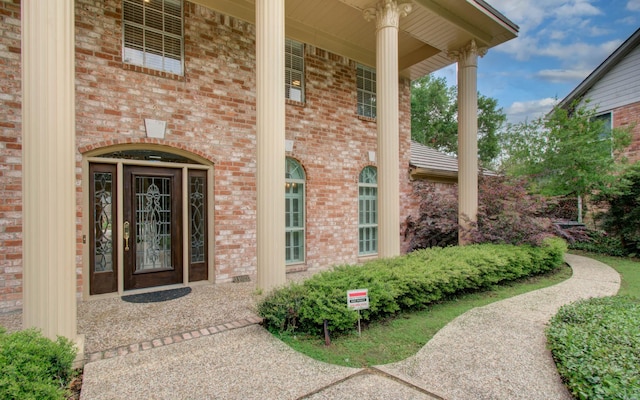 11022 Riverview Dr, Houston, TX 77042 - doorway to property featuring brick siding