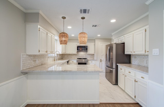 11022 Riverview Dr, Houston, TX 77042 - kitchen featuring a sink, a peninsula, visible vents, and appliances with stainless steel finishes