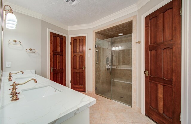 11022 Riverview Dr, Houston, TX 77042 - full bath with a sink, a stall shower, visible vents, and tile patterned floors