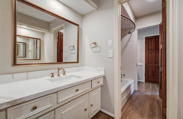 11022 Riverview Dr, Houston, TX 77042 - bathroom with bathing tub / shower combination, wood finished floors, and vanity
