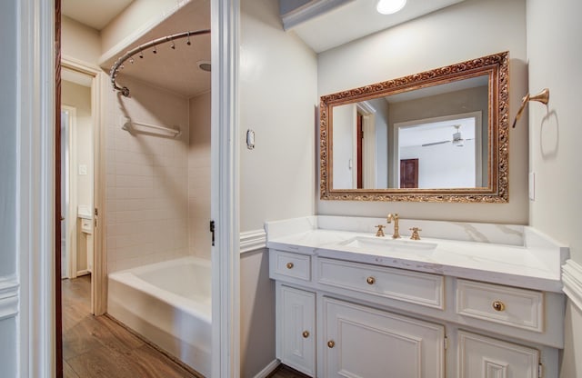11022 Riverview Dr, Houston, TX 77042 - bathroom with vanity, bathtub / shower combination, and wood finished floors