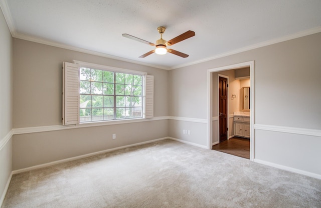11022 Riverview Dr, Houston, TX 77042 - carpeted empty room with crown molding, baseboards, and a ceiling fan