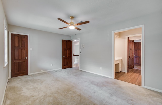 11022 Riverview Dr, Houston, TX 77042 - unfurnished bedroom with ceiling fan, ensuite bathroom, carpet floors, and baseboards