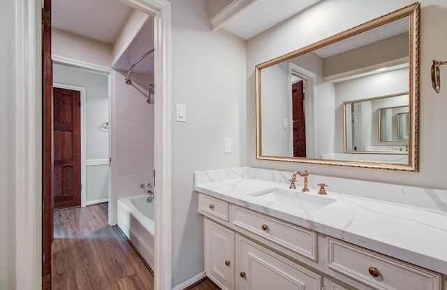11022 Riverview Dr, Houston, TX 77042 - bathroom with bathing tub / shower combination, wood finished floors, and vanity