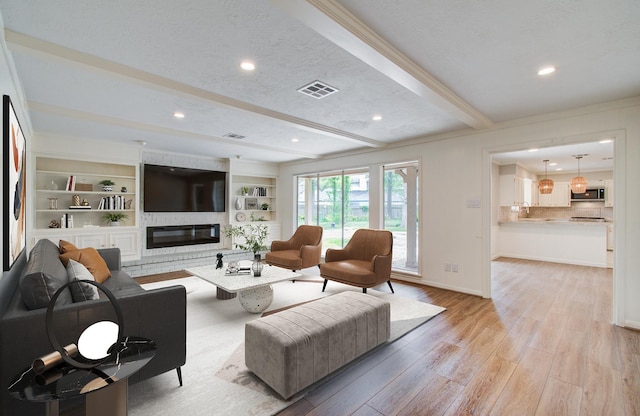 11022 Riverview Dr, Houston, TX 77042 - living room with recessed lighting, baseboards, light wood finished floors, visible vents, and beamed ceiling