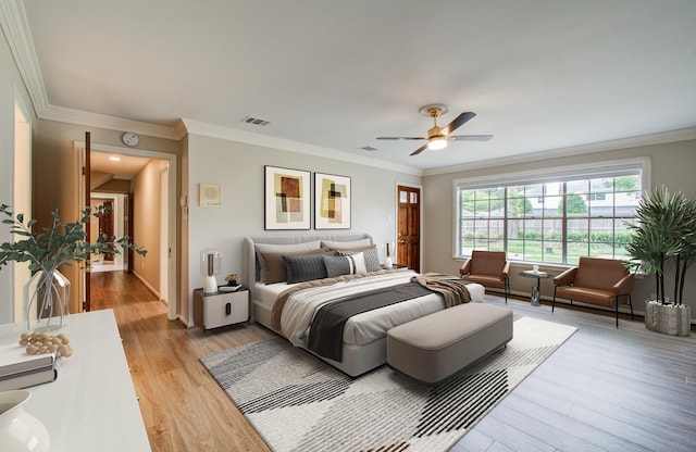 11022 Riverview Dr, Houston, TX 77042 - bedroom with ceiling fan, crown molding, visible vents, and light wood-type flooring