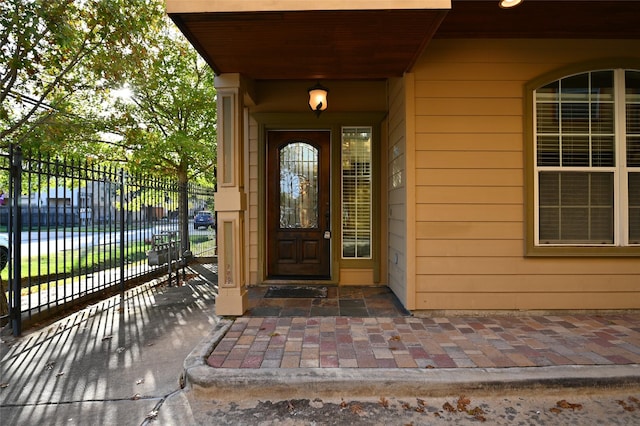 doorway to property with fence