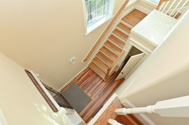stairway with wood finished floors