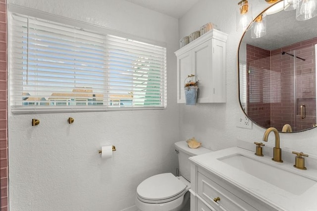 501 Jean Lafitte Cv, Galveston, TX 77554 - full bathroom with a stall shower, vanity, toilet, and a textured wall