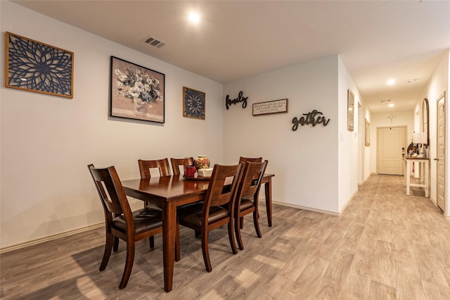 9705 Wall St, Texas City, TX 77591 - dining area with baseboards, visible vents, and light wood-type flooring