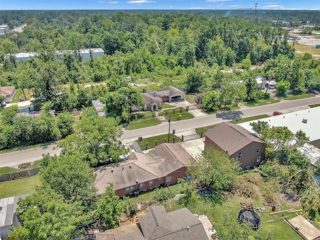 birds eye view of property with a forest view and a residential view