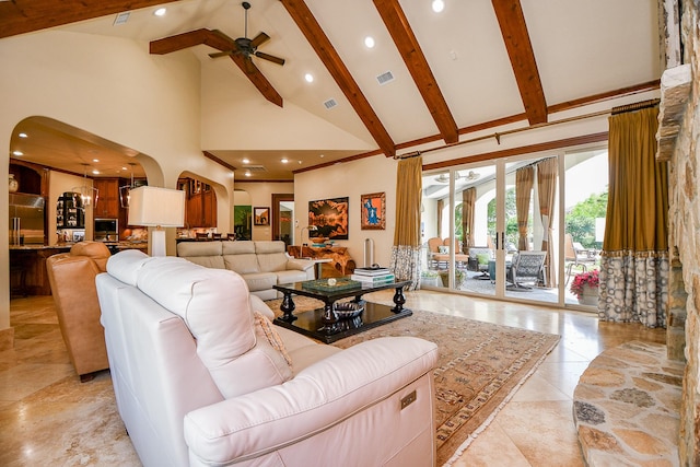 2718 Silverhorn Dr, Katy, TX 77450 - living room featuring high vaulted ceiling, beamed ceiling, a ceiling fan, arched walkways, and recessed lighting