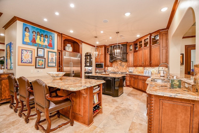 2718 Silverhorn Dr, Katy, TX 77450 - kitchen featuring built in appliances, open shelves, recessed lighting, a center island with sink, and backsplash