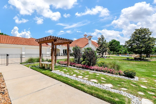 2718 Silverhorn Dr, Katy, TX 77450 - view of yard featuring a pergola, driveway, and an attached garage
