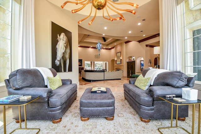 2718 Silverhorn Dr, Katy, TX 77450 - living area featuring a chandelier, crown molding, recessed lighting, a raised ceiling, and a towering ceiling