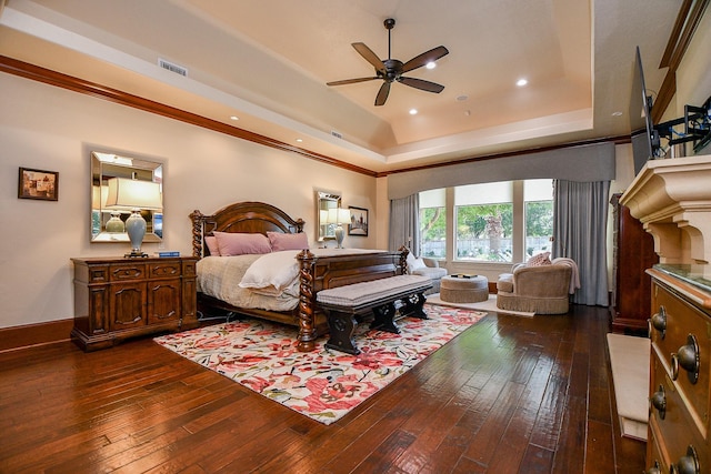 2718 Silverhorn Dr, Katy, TX 77450 - bedroom with dark wood finished floors, a tray ceiling, ornamental molding, recessed lighting, and ceiling fan