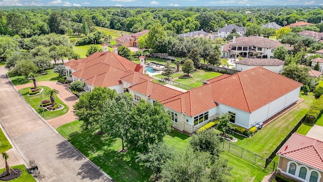 2718 Silverhorn Dr, Katy, TX 77450 - aerial perspective of suburban area with a heavily wooded area