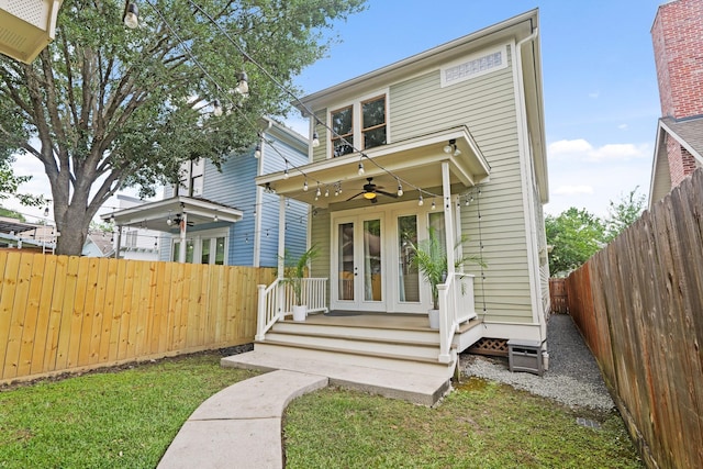 traditional style home featuring french doors and ceiling fan