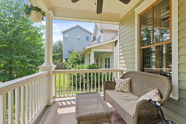 balcony with a ceiling fan and covered porch