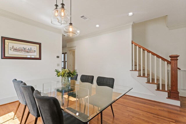 dining area with crown molding, wood finished floors, stairs, recessed lighting, and baseboards