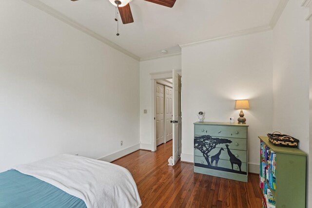 bedroom featuring crown molding, wood finished floors, baseboards, and a ceiling fan