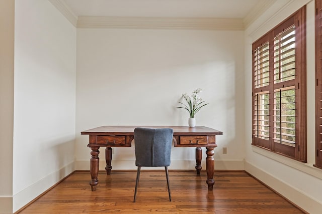 office area with wood finished floors, plenty of natural light, ornamental molding, and baseboards