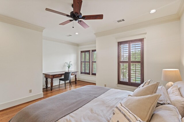 bedroom featuring recessed lighting, wood finished floors, ornamental molding, baseboards, and ceiling fan