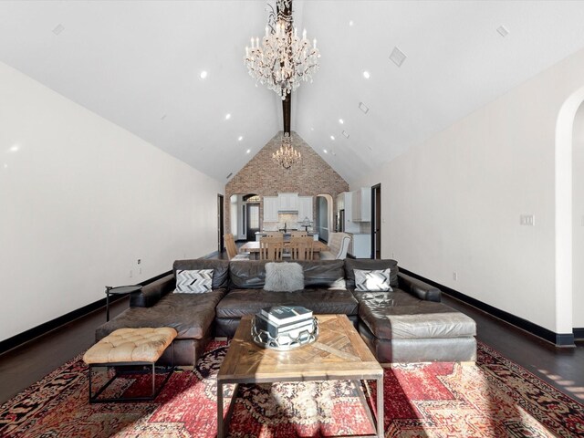 living room featuring arched walkways, a chandelier, high vaulted ceiling, baseboards, and recessed lighting