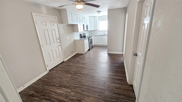 1314 Burbank St, Baytown, TX 77520 - interior space with baseboards, dark wood finished floors, a sink, and a textured wall