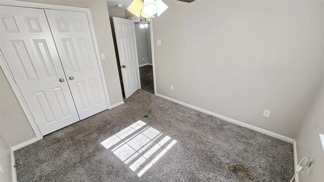 1314 Burbank St, Baytown, TX 77520 - unfurnished bedroom featuring ceiling fan, carpet, a closet, and baseboards