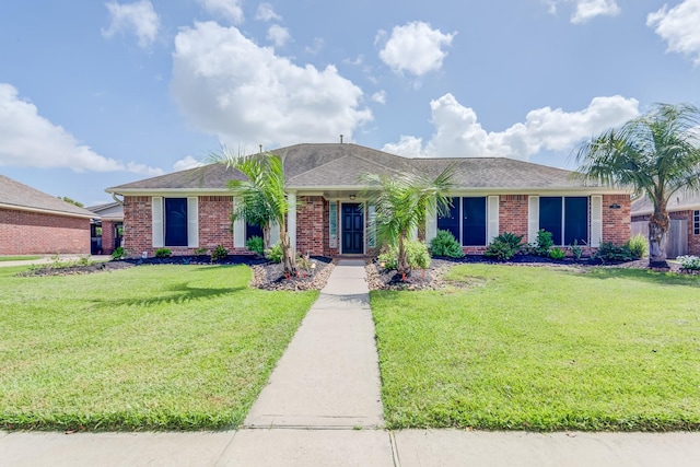 410 Scarlet Sage Dr, League City, TX 77573 - ranch-style home featuring brick siding, a front lawn, and roof with shingles