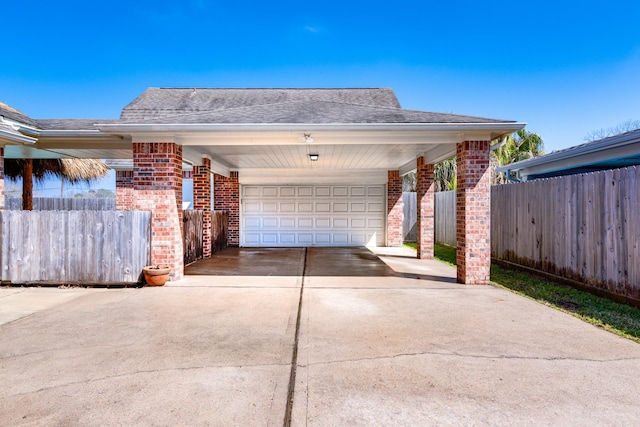 410 Scarlet Sage Dr, League City, TX 77573 - view of home's exterior featuring brick siding, concrete driveway, a garage, and roof with shingles