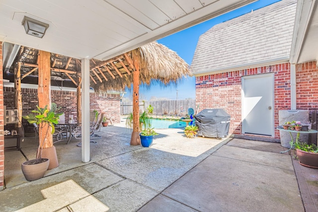 410 Scarlet Sage Dr, League City, TX 77573 - fenced backyard with a patio, grilling area, and outdoor dining area