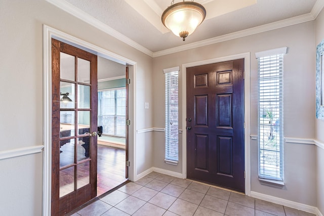 410 Scarlet Sage Dr, League City, TX 77573 - foyer entrance featuring light tile patterned flooring and crown molding