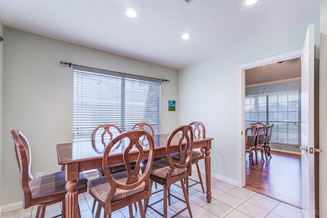 410 Scarlet Sage Dr, League City, TX 77573 - dining space featuring healthy amount of natural light, light tile patterned floors, and recessed lighting