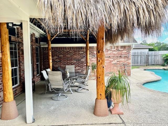 410 Scarlet Sage Dr, League City, TX 77573 - view of patio featuring outdoor dining space
