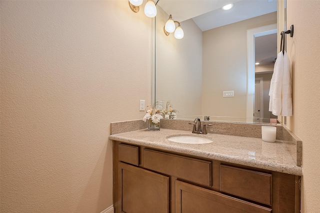 bathroom with vanity and recessed lighting